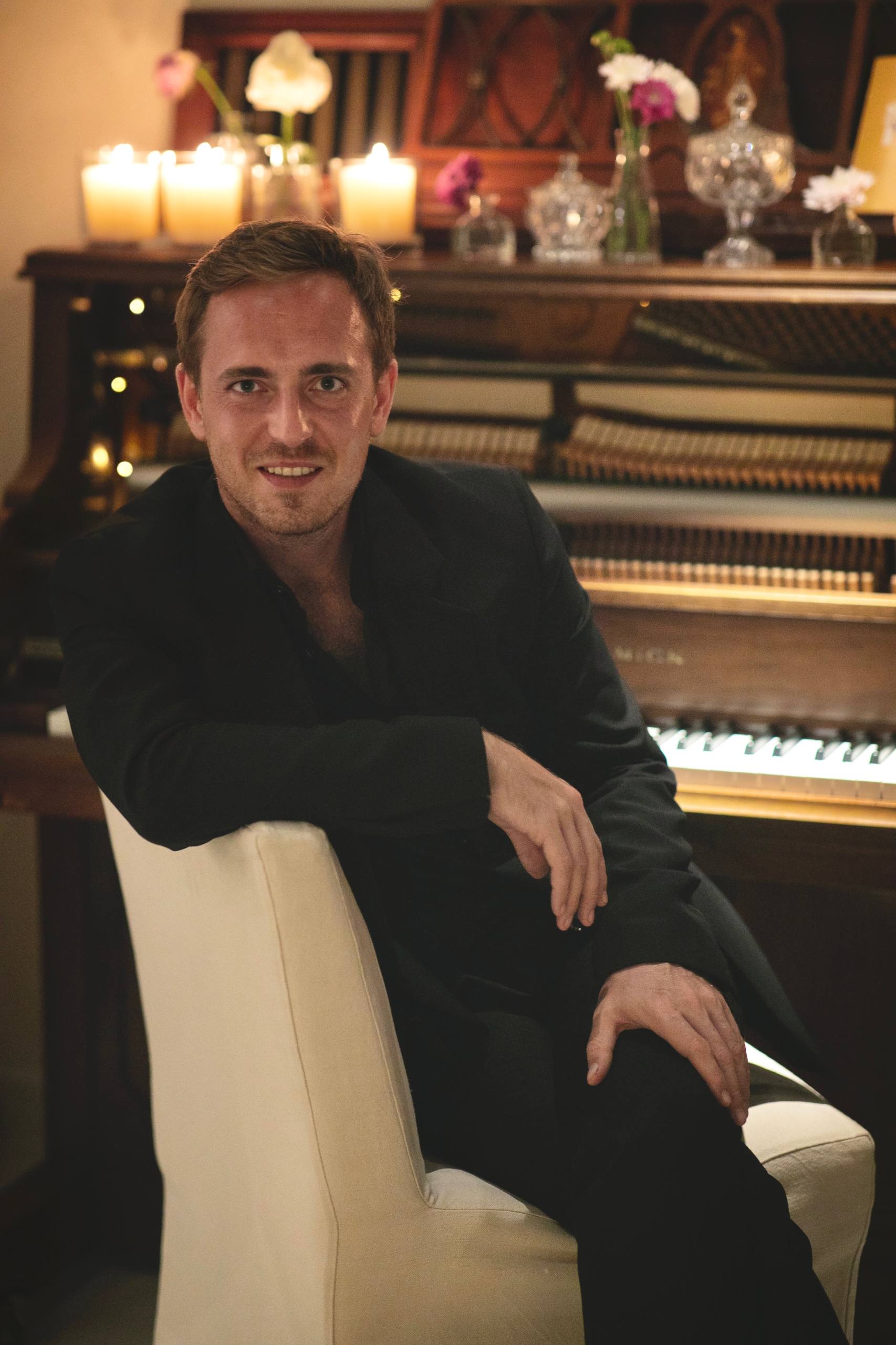 Vlad Rotberg at the piano, smiling